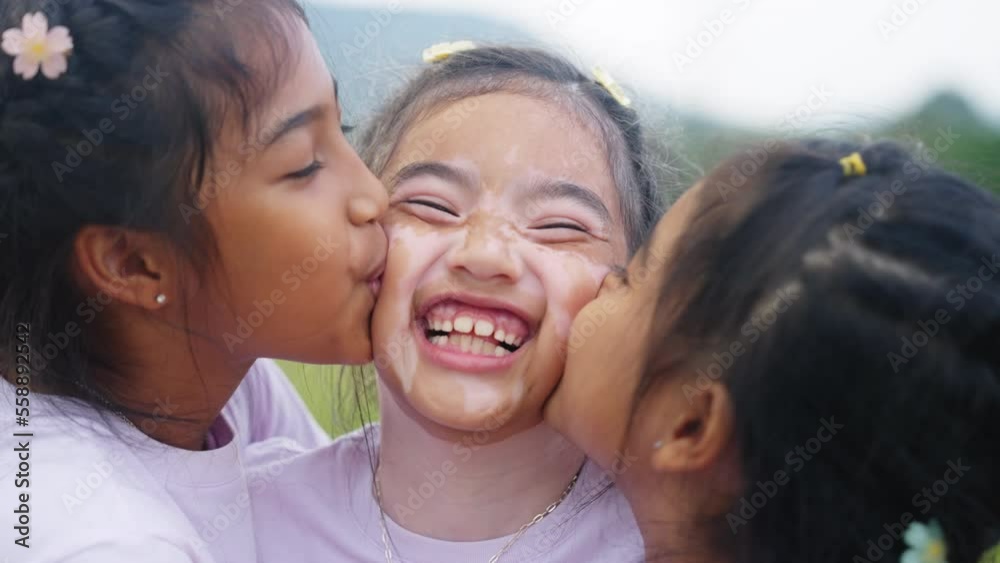 Three little cute child asia sisters kiss cheek cuddle hug look at camera smile fun having good time best friend. Diverse skin sibling Young people small kid girls love trust relax happy sweet moment. Three little cute child asia sisters kiss cheek cuddle hug look at camera smile fun having good time best friend. Diverse skin sibling Young people small kid girls love trust relax happy sweet moment.