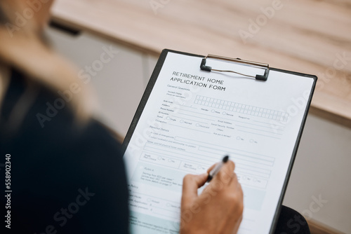Retirement home, application form or hand of woman writing personal information to register on paper or clipboard. Contract, compliance or person signing on registration paperwork or legal documents