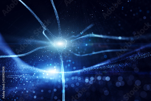 Artistic blue colored shining neuron cell in the brain on artistic cyber space background with flare lights. Selective focus used.