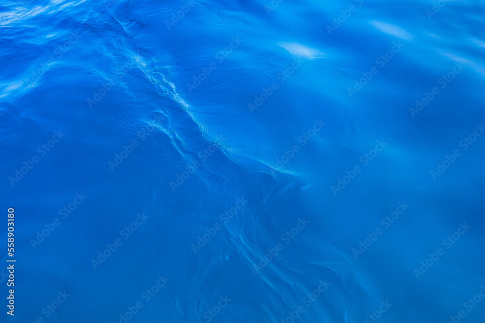 Very nice sea water background or backdrop with selective focus. Small waves of natural water surface texture. Very nice sea water background or backdrop with selective focus. Small waves of natural water surface texture.