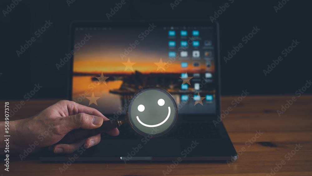 Customer service and Satisfaction concept, Business people holding magnifying glass with happy Smiley face icon to searching for satisfaction in service. rating very impressed. Customer service and Satisfaction concept, Business people holding magnifying glass with happy Smiley face icon to searching for satisfaction in service. rating very impressed.