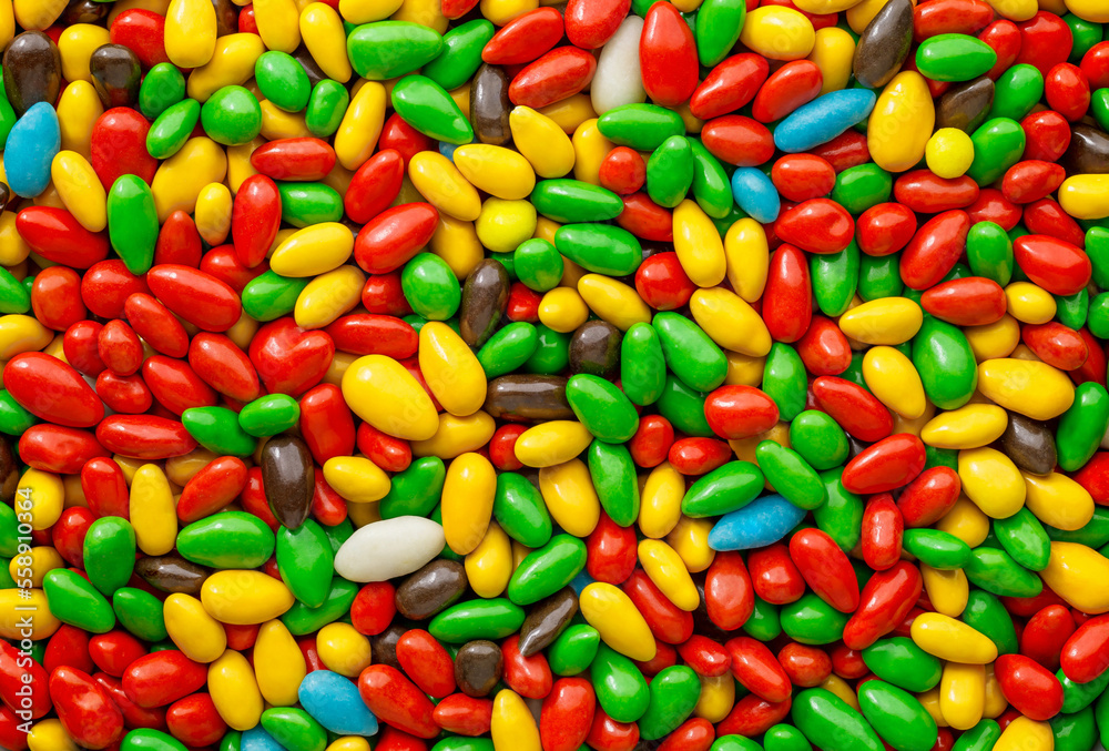Candy in multi colored glaze in bulk, wallpaper background Candy in multi colored glaze in bulk, wallpaper background
