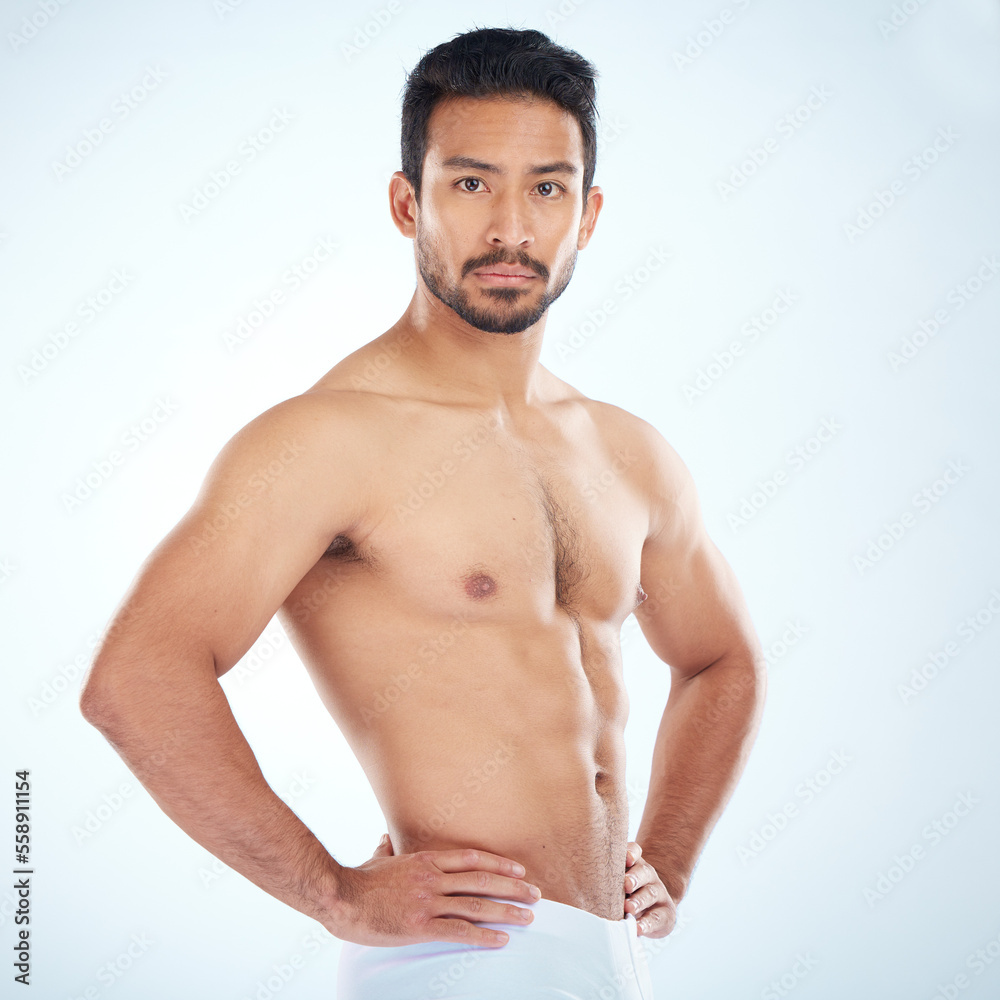 Fototapeta premium Body, fitness and portrait of man in studio isolated on a gray background mockup. Sports, training and athletic, strong and healthy male model ready for exercise or workout for health and wellness