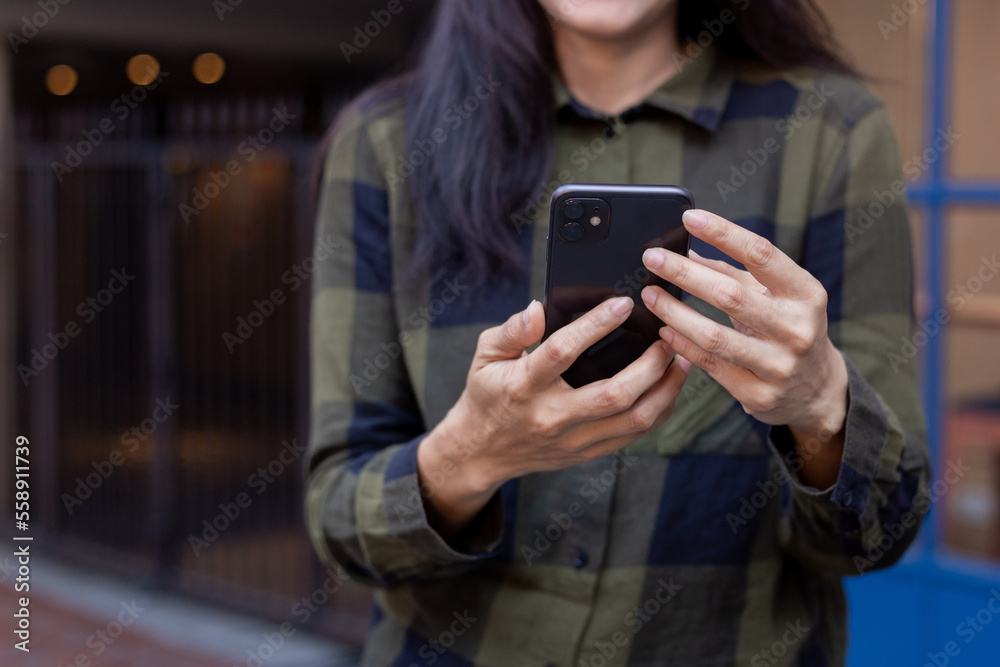 woman using cell phone hand holding mobile texting message contact us.chatting,search internet information.technology device communication connecting woman using cell phone hand holding mobile texting message contact us.chatting,search internet information.technology device communication connecting