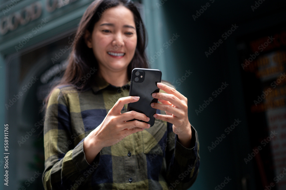 woman using cell phone hand holding mobile texting message contact us.chatting,search internet information.technology device communication connecting
