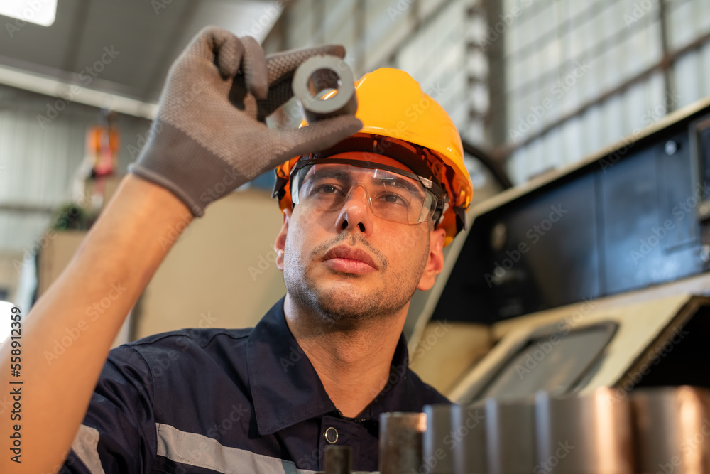 Engineer factory industry wearing safety uniform work and checking system of the welding robots for welding steel electrical control system is robot automate for industry manufacture concept.