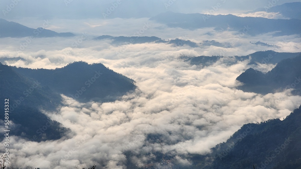 Beautiful bird's-eye view of the sea of mist in the green mountain forest, Phu Chee Fah, Thoeng District, Chiang Rai, Thailand. Beautiful bird's-eye view of the sea of mist in the green mountain forest, Phu Chee Fah, Thoeng District, Chiang Rai, Thailand.