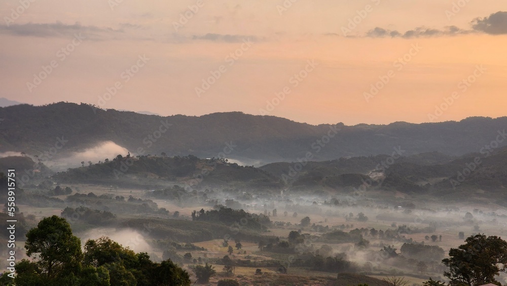 Fototapeta premium Beautiful bird's-eye view of the sea of mist in the green mountain forest, Phu Chee Fah, Thoeng District, Chiang Rai, Thailand.