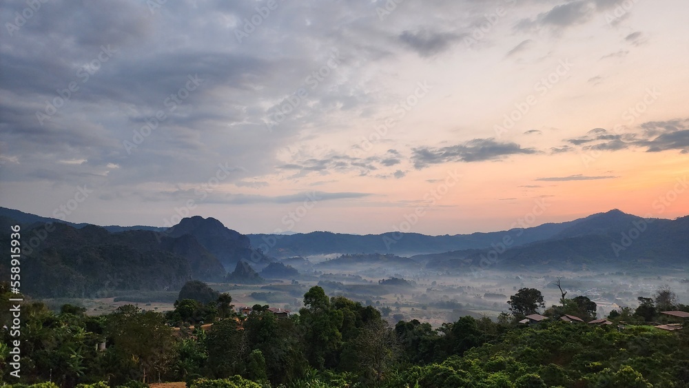 Fototapeta premium Beautiful bird's-eye view of the sea of mist in the green mountain forest, Phu Chee Fah, Thoeng District, Chiang Rai, Thailand.