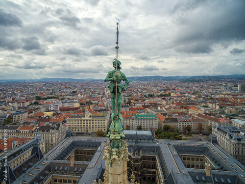 Rathaus Roof with Statue. Vienna, Austria. Vienna Cityscape in Background.
