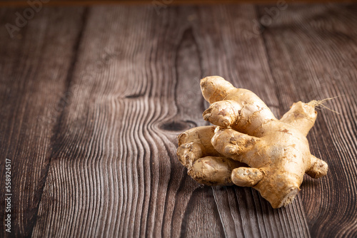 Organic fresh ginger root on the table. photo