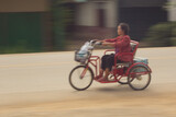 asian old woman with .bicycle panning camera
