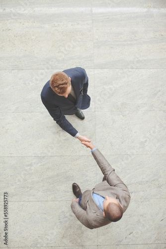 Businesspeople shaking hands after agreement