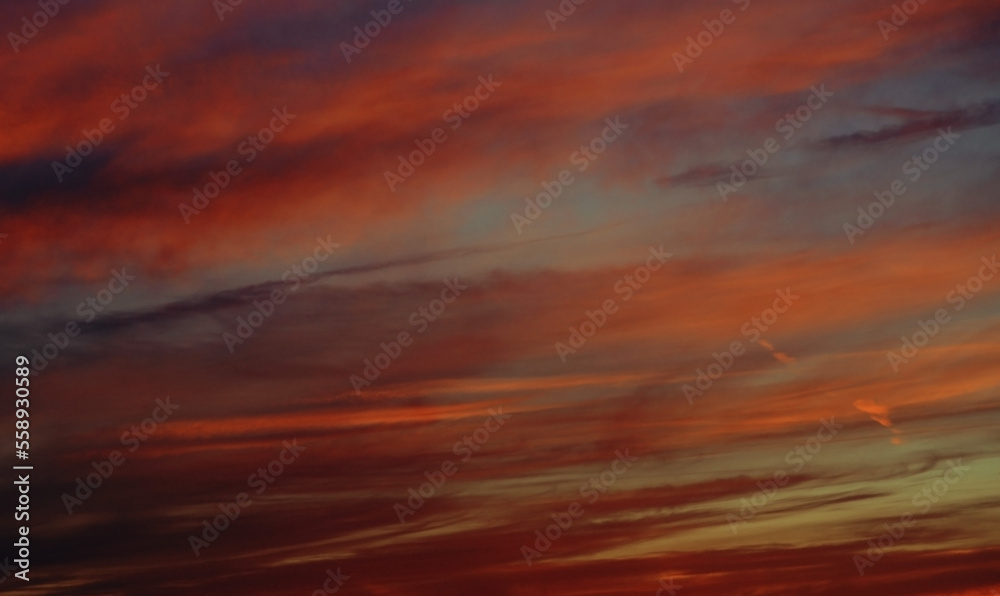 The sky after sunset is the background. beautiful nature background. panorama of a cloudy landscape at sunset with bright and dreamy colors in the sky. space for copying. romantic
