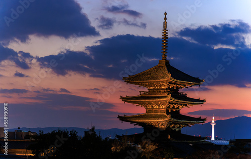 Sunset over traditional and modern landmark towers in Kyoto