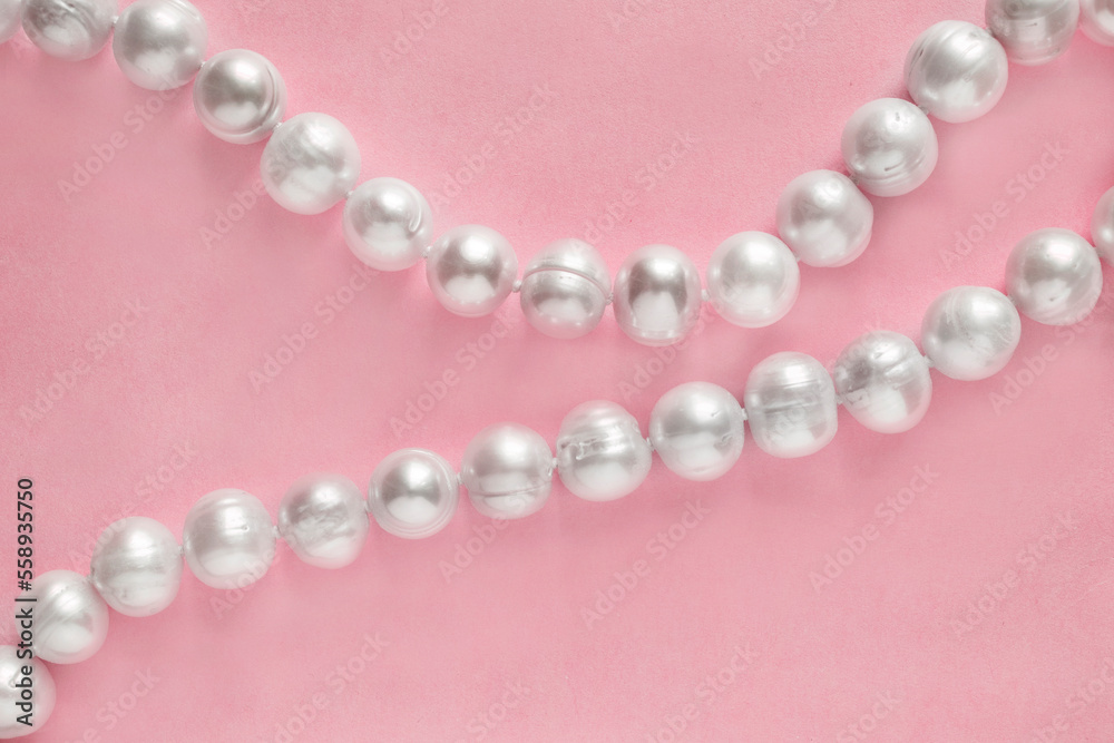 Pearl strings on pink