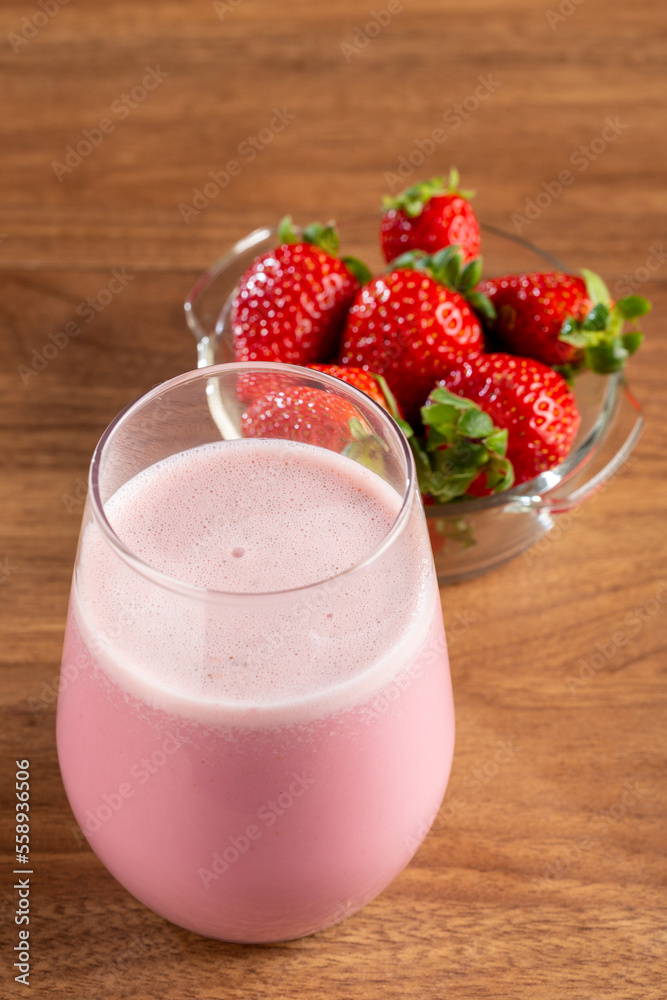 Glass with tasty strawberry smoothie. Glass with tasty strawberry smoothie.