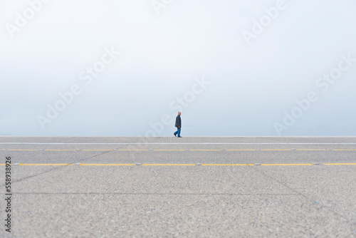 Lonely man walking (ID: 558938926)