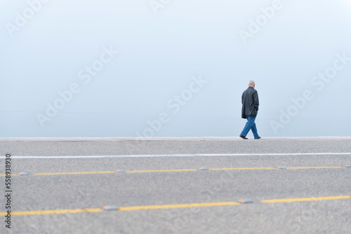 Lonely man walking (ID: 558938930)