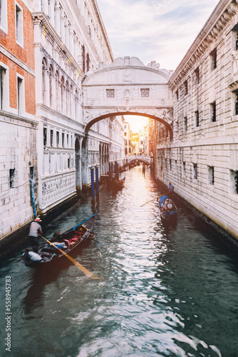 Gondola on canal with the Bridge of Sighs in Venice, Italy