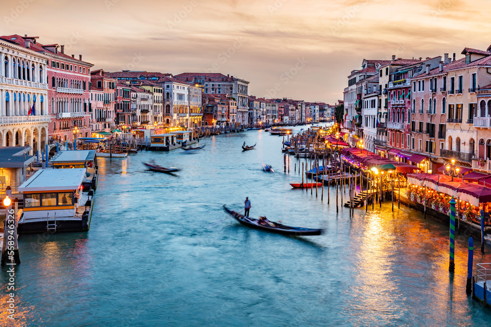 Grand Canal in Venice, Italy at sunset with gondolas