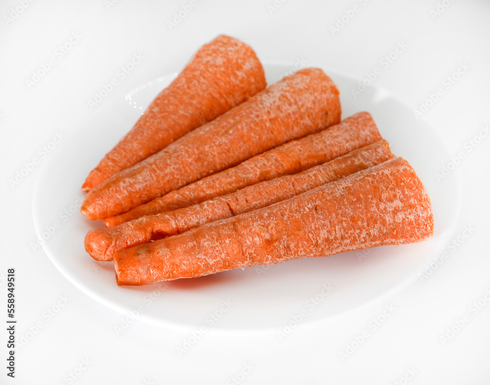 Peeled fresh carrots on a white background. Delicious fresh carrots. Fresh vegetables on the table. Peeled fresh carrots on a white background. Delicious fresh carrots. Fresh vegetables on the table.
