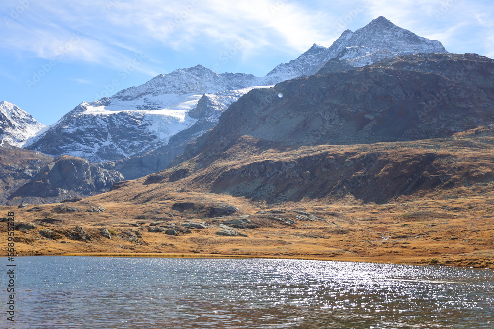 View on the Bianco Lake which is a reservoir at the Bernina pass in the Swiss canton of Graubünden