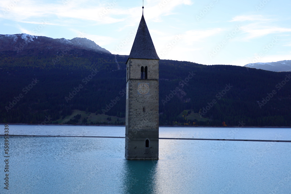 The Lake Reschen is an artificial lake in the western portion of South Tyrol, Italy