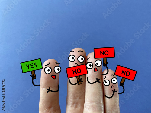 Four fingers are decorated as four person. All of them except one is not agreeing with the decision. He is discriminated.