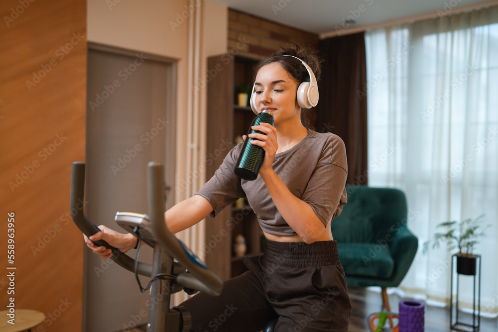One woman young training on Indoor Cycling stationary Exercise Bike