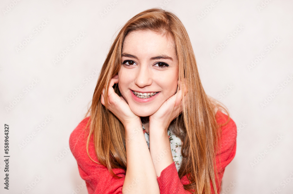 candid portrait of a girl with braces, isolated on white background candid portrait of a girl with braces, isolated on white background