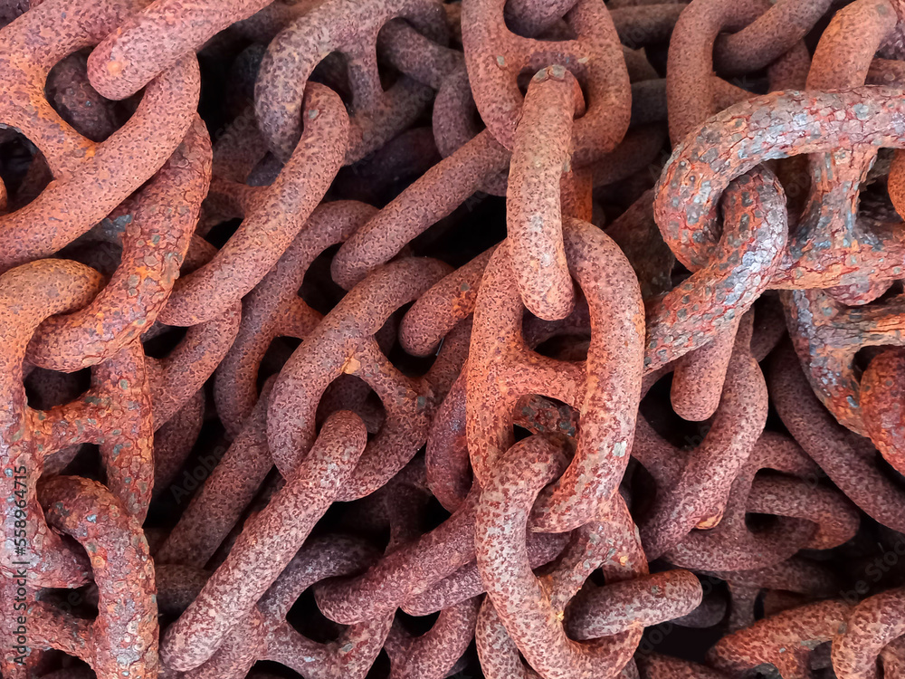 Background of rusty metal rings. Chain links with rust. Full frame of old iron chain. Abstract textures and backgrounds. Background of rusty metal rings. Chain links with rust. Full frame of old iron chain. Abstract textures and backgrounds.