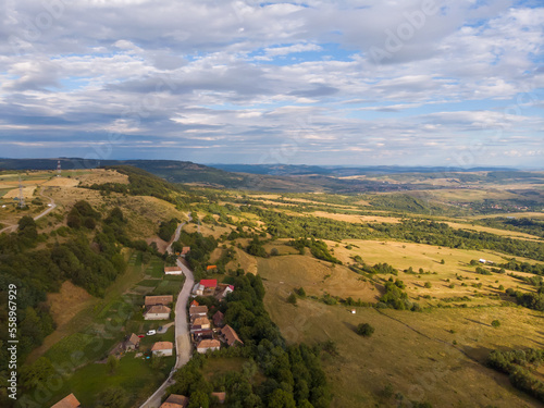 Aerial shot of the majestic hilly Bihar mountains, beautiful green forests, cozy landscapes at sunset