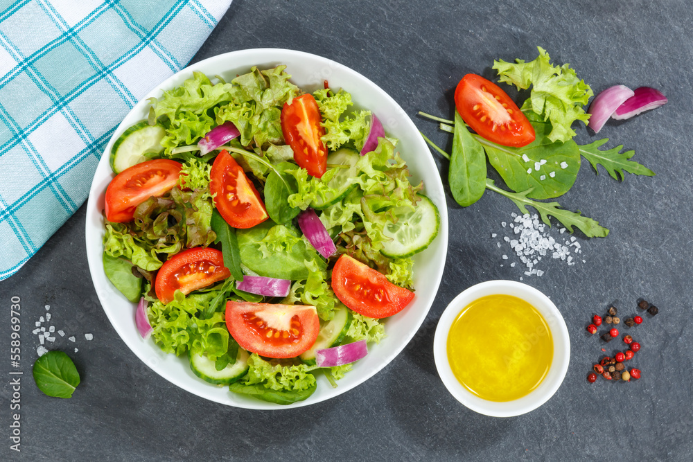 Mixed salad with fresh tomatoes healthy eating food from above on a slate Mixed salad with fresh tomatoes healthy eating food from above on a slate