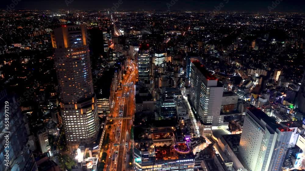 TOKYO - OCT 3rd, 2022: Aerial view of traffic through Shibuya, Tokyo, Japan at night TOKYO - OCT 3rd, 2022: Aerial view of traffic through Shibuya, Tokyo, Japan at night