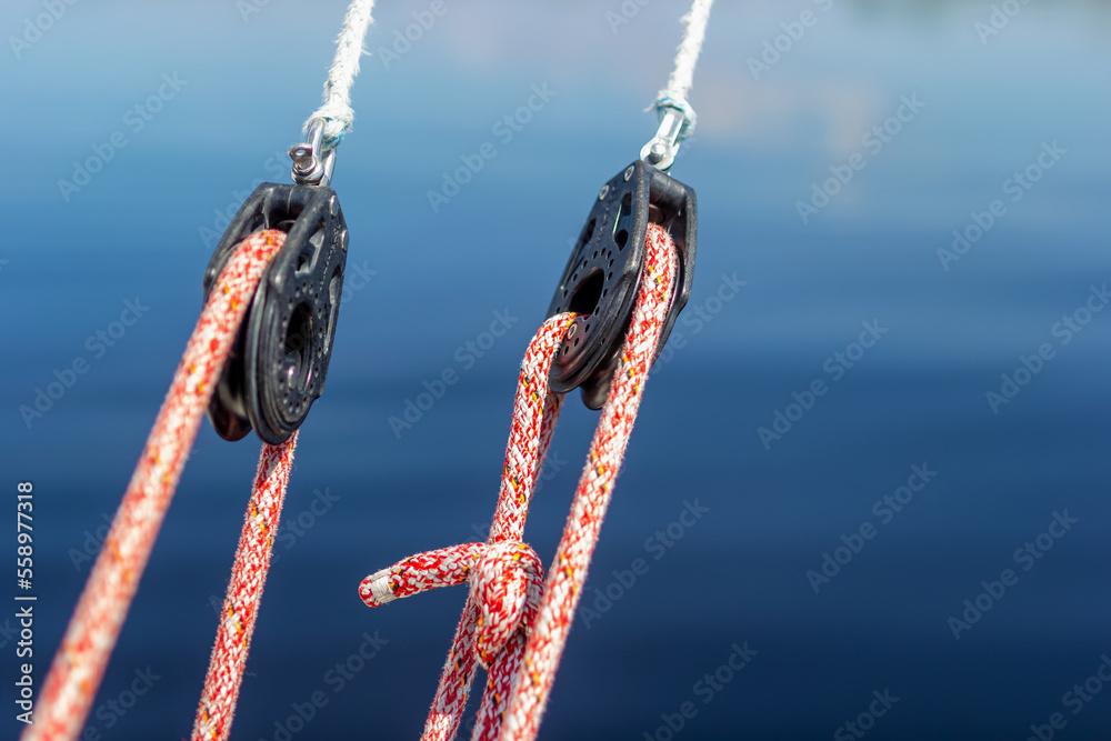 Rigging on a modern sailing yacht. Blocks, ropes, winches for raising