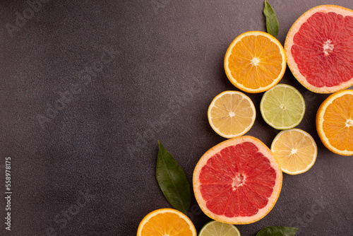 Fototapeta Naklejka Na Ścianę i Meble -  Citrus background with limes, lemons, grapefruits and oranges