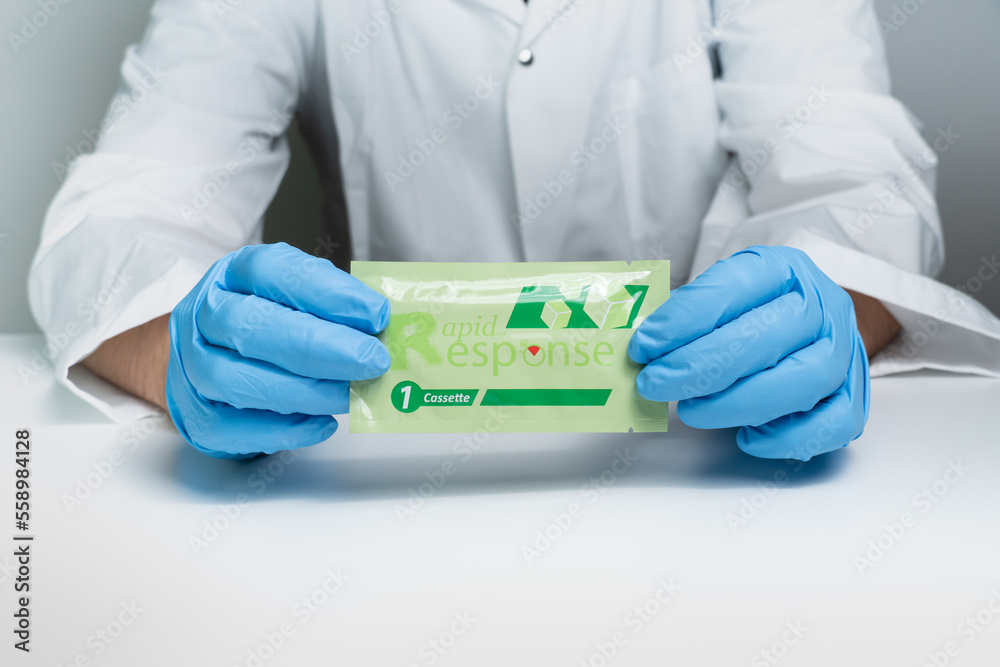 Toronto, Ontario, Canada December 30, 2022 Male nurse holding Covid