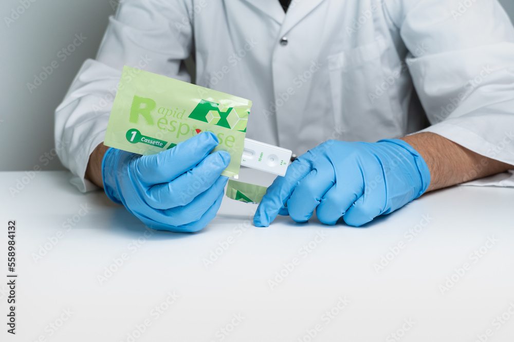 Toronto, Ontario, Canada December 30, 2022 Male nurse holding Covid