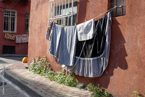 Clothes are suspended on a line to dry,Fener, Balat, Istanbul photo