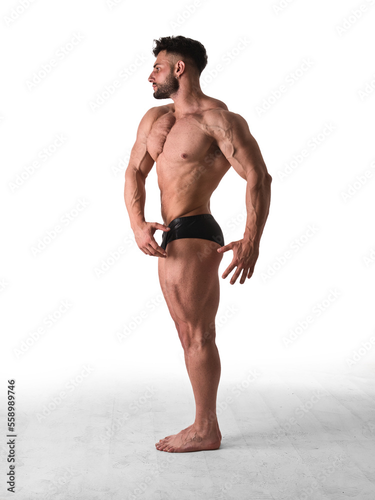 Obraz premium Full figure shot of handsome shirtless athletic young man