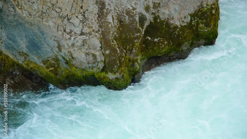 Canyon River with Pure Turquoise Glacier Water, Unusual Mountain Nature Landscape in Iceland. Travel Europe. Shot in 8K Resolution 4320p photo