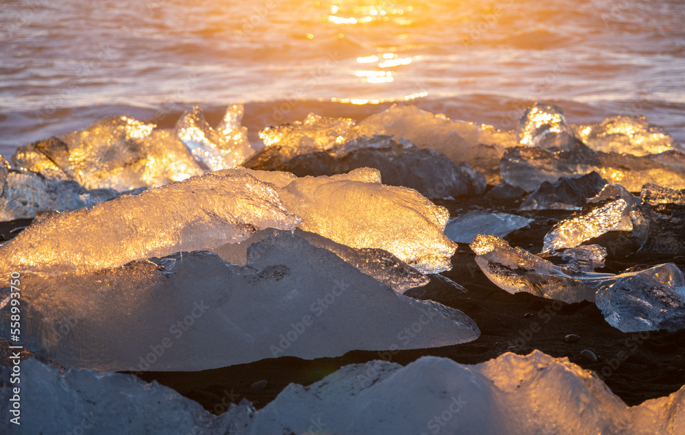 Diamond Beach in Iceland. Icebergs Shining on Black Volcanic Sand at Sunset. Clear Ice Crashed by Ocean Waves. Famous Tourist Location in North Europe Country. Travel Destination. High Resolution