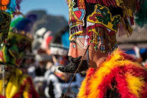 Chinelo or Chinelos are a traditional colorful costumed dancer in carnaval, is popular in the Mexican state of Morelos near Tepoztlan , State of Mexico and Mexico City, Milpa Alta and Xochimilco.