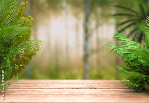 Defocused misty jungle background with empty wooden table for copy space  product display  eco advertising  ads etc. Eco backgrounds and textures. 3d render.