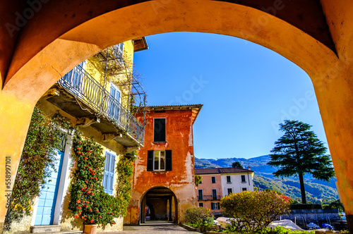 old town and port of Mandello del Lario in italy photo