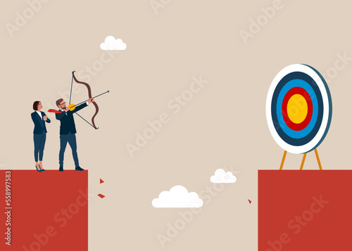 Business target goals. Forced to successful. Man standing on cliff with archer in hand. Shooting target with bow, arrow. Modern flat vector illustration. photo