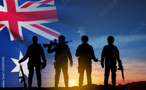 Silhouette of Soldiers with Australian flag on background of sunset. Concept - Armed Force. EPS10 vector