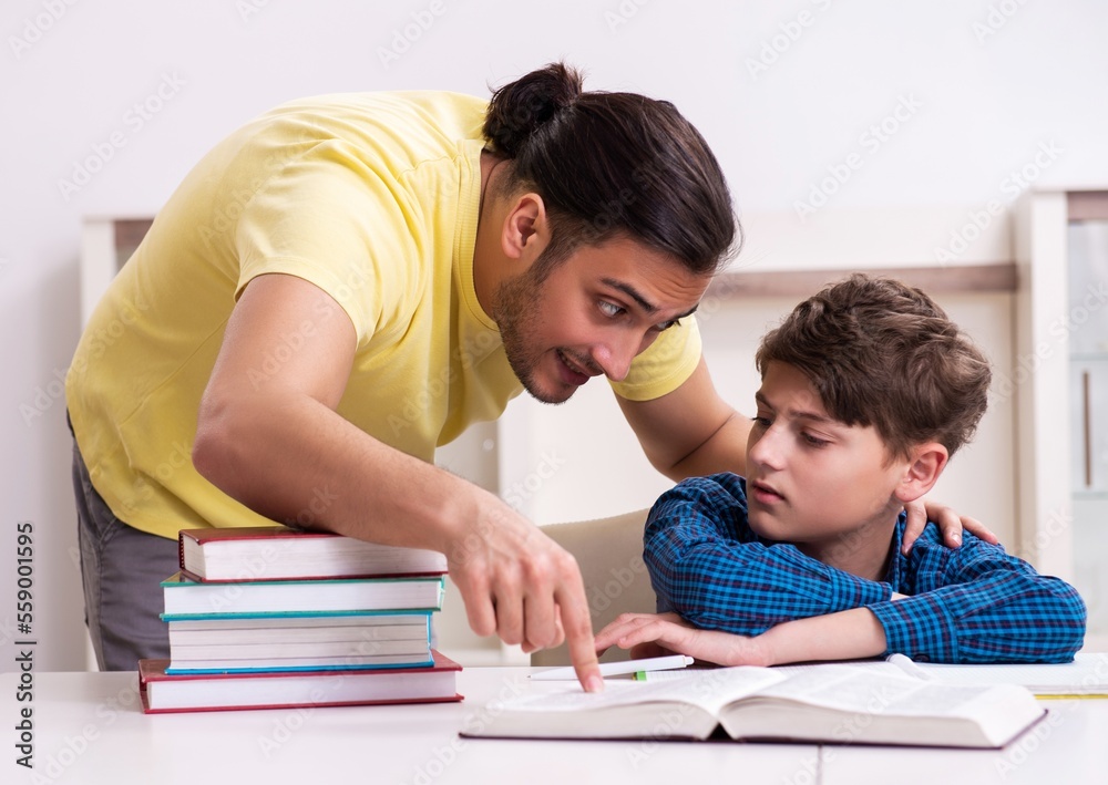 Father helping his son to prepare for school Father helping his son to prepare for school