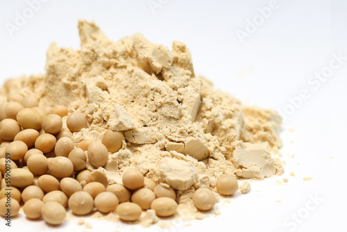 Fototapeta Naklejka Na Ścianę i Meble -  Closeup pile of Soybeans powder together with soybeans seeds isolated on white background, copy space